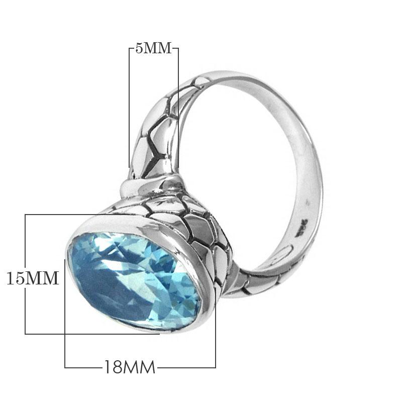 Handcrafted sterling silver ring with oval Blue Topaz Quartz and artisan carved band, made in Bali