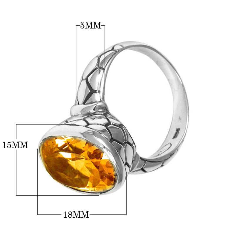 Handcrafted sterling silver ring with oval Citrine Quartz and artisan carved band, made in Bali.