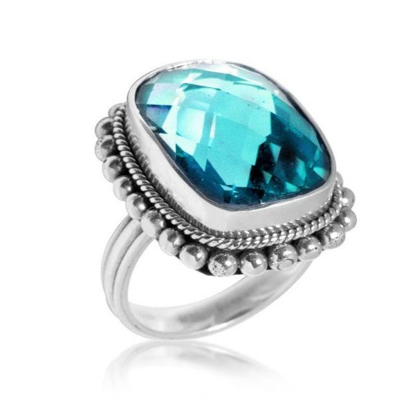 Sterling silver ring with sparkling cushion-cut blue Topaz Quartz, detailed rope bezel and beaded frame, handcrafted for elegant everyday or special occasion wear