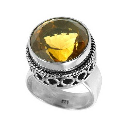 Sterling silver citrine ring with a faceted golden Quartz, rope bezel, and cutout band design, handcrafted in Bali for a bold artisan look.