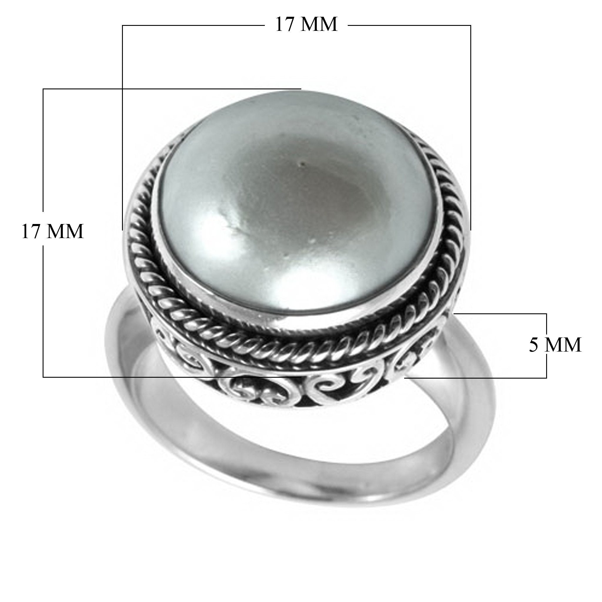 Sterling silver mother of pearl ring with polished cabochon stone, twisted rope bezel, and elegant Balinese scrollwork, handcrafted in Bali.