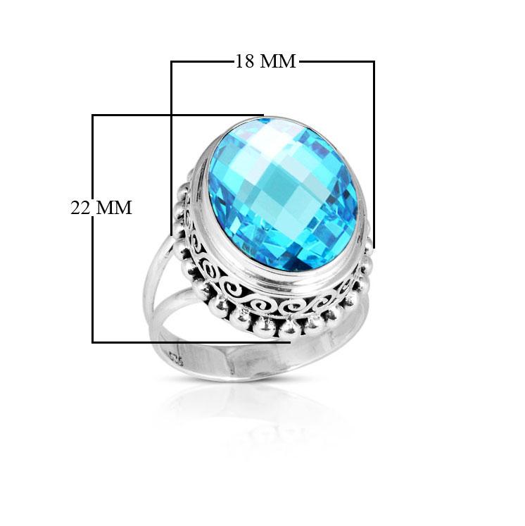 Sterling silver ring with faceted oval Blue Topaz Quartz, Balinese scroll and bead details – handcrafted artisan cocktail jewelry.
