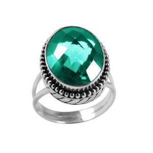 Sterling silver ring with faceted oval Green Quartz and Balinese bead details – handcrafted artisan cocktail jewelry.