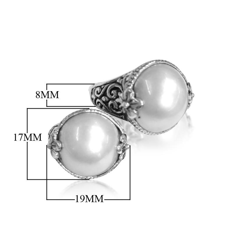 Sterling silver ring with radiant round Pearl and Balinese Floral scroll details – handcrafted artisan cocktail jewelry.