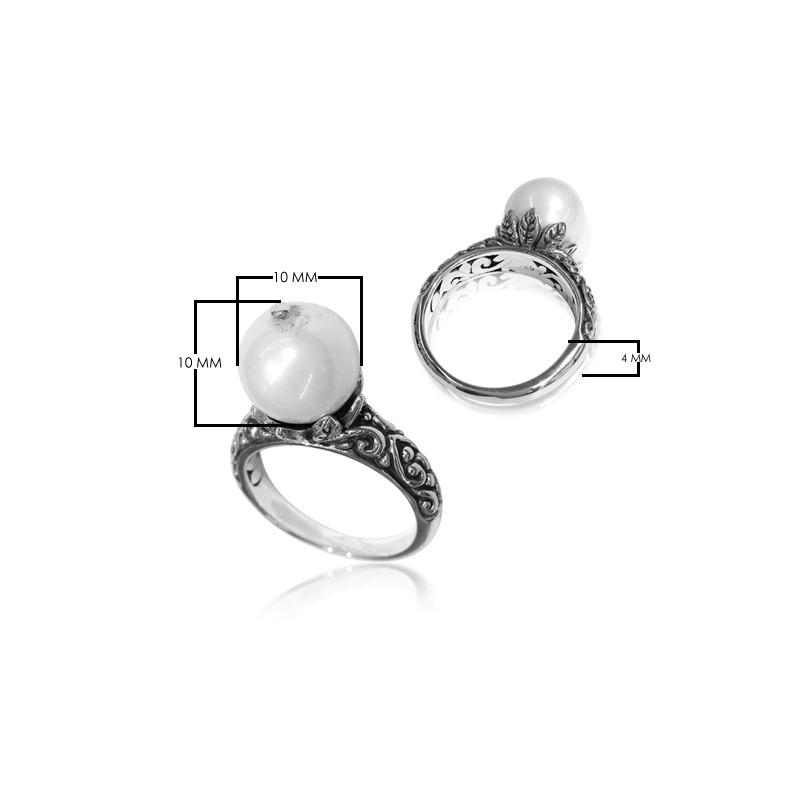 Elegant Balinese silver ring with white freshwater pearl and artisan scroll design.