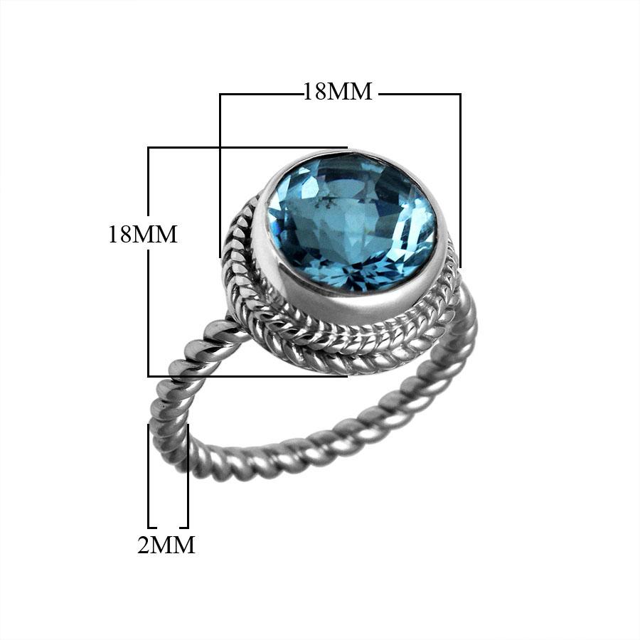 Handcrafted Bali silver ring with round Blue Topaz Quartz and rope-style band.