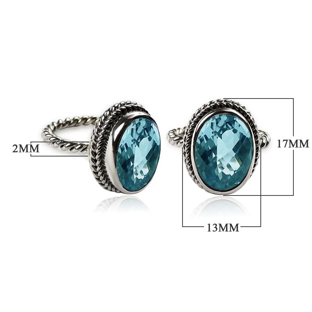 Handcrafted Bali silver ring with oval Blue Topaz Quartz and rope-style band.