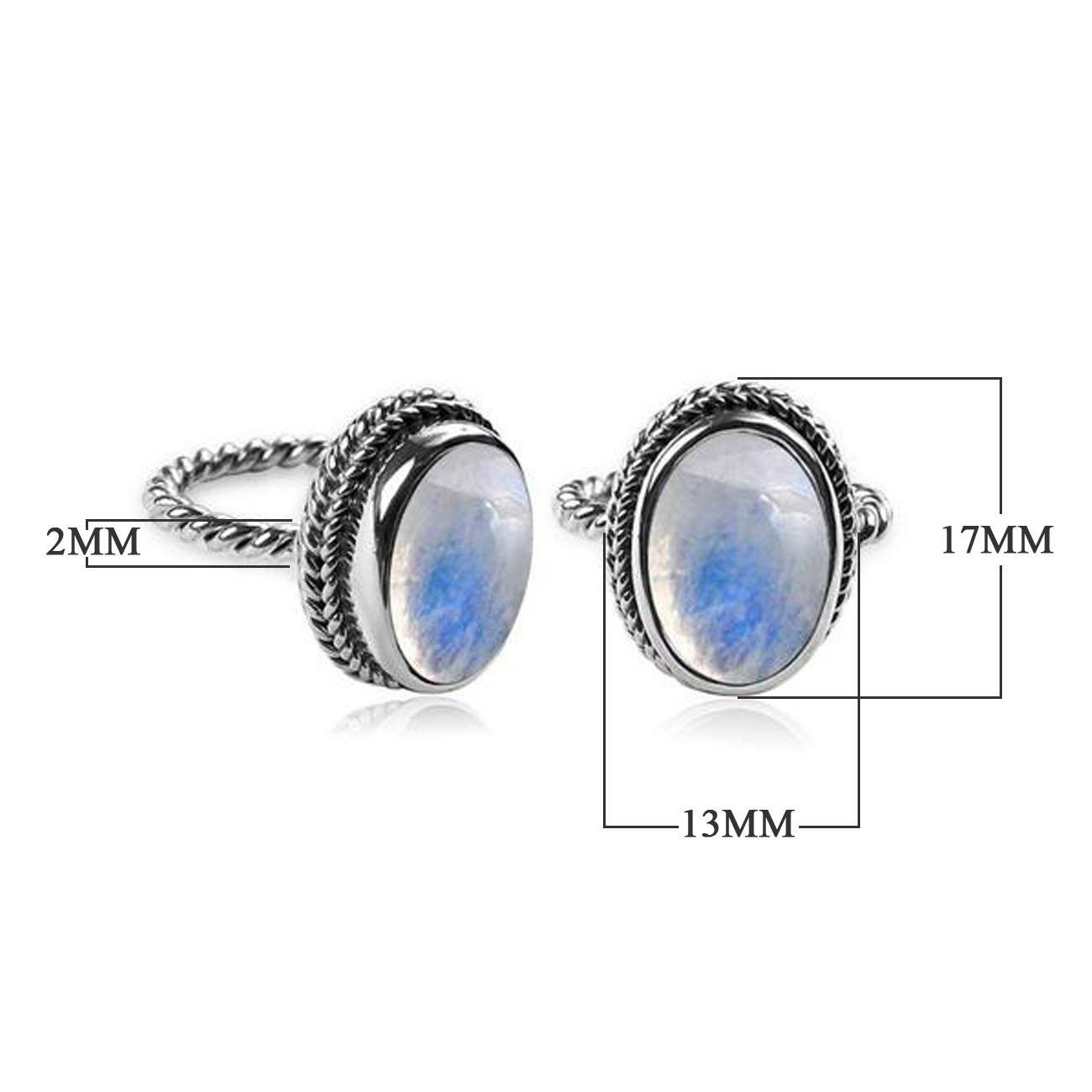 Handcrafted sterling silver Rainbow Moonstone Quartz ring with oval cabochon Quartz and rope bezel, artisan jewelry from Indonesia.
