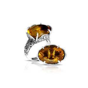 Handcrafted sterling silver Bali ring with oval golden Citrine Quartz and intricate carvings.