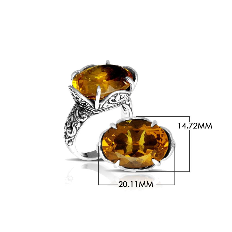 Handcrafted sterling silver Bali ring with oval golden Citrine Quartz and intricate carvings.