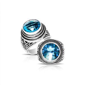 Handcrafted sterling silver Bali ring with round Blue Topaz Quartz and detailed rope scrollwork.