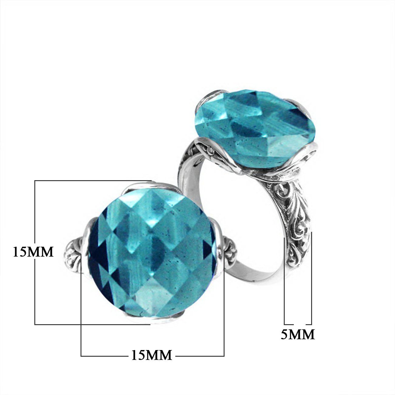 Handcrafted Bali sterling silver ring with faceted round Blue Topaz Quartz and scroll-carved band.