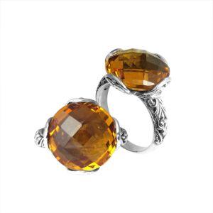 Handcrafted sterling silver Bali ring with faceted round Citrine Quartz and scroll-carved band.