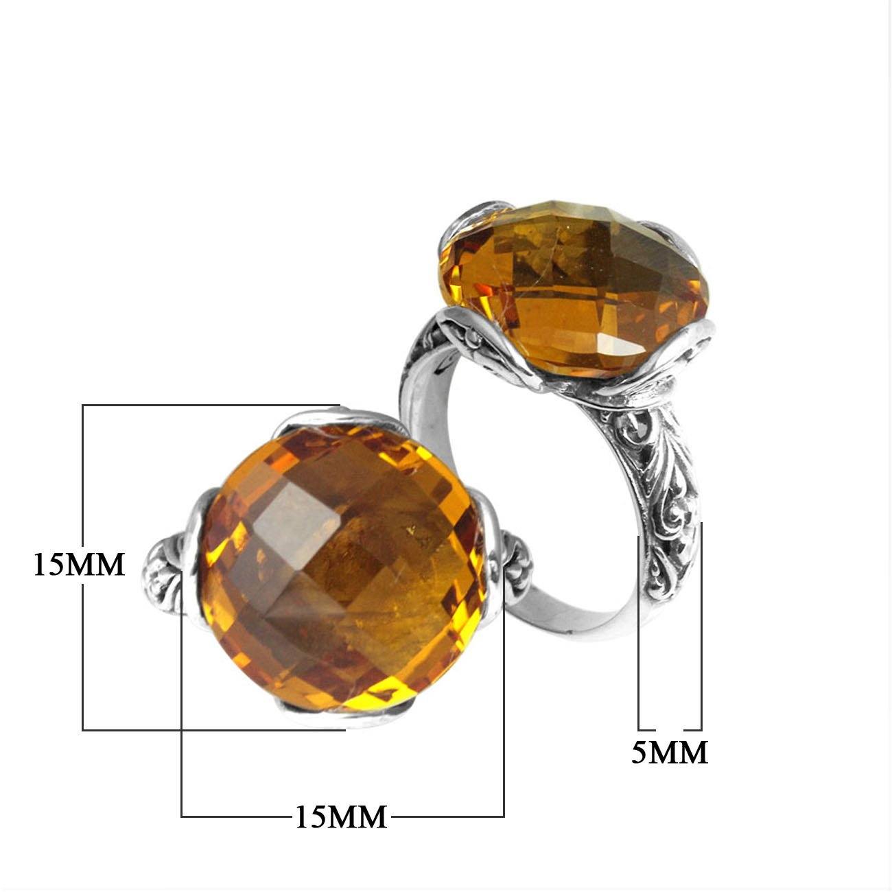 Handcrafted sterling silver Bali ring with faceted round Citrine Quartz and scroll-carved band.
