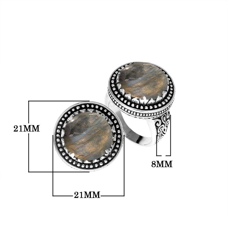 Handcrafted sterling silver Bali ring with Labradorite cabochon and beaded halo design.