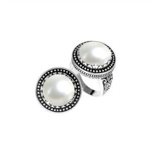 Handcrafted sterling silver Bali ring with Luminous Mother of Pearl cabochon and beaded halo.
