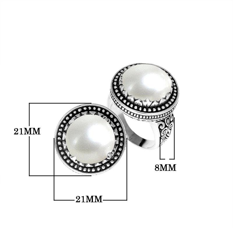 Handcrafted sterling silver Bali ring with Luminous Mother of Pearl cabochon and beaded halo.