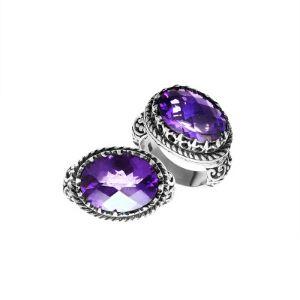 Handmade sterling silver Balinese ring with faceted Amethyst Quartz and detailed carvings.