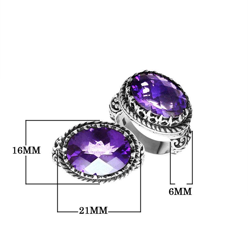 Handmade sterling silver Balinese ring with faceted Amethyst Quartz and detailed carvings.