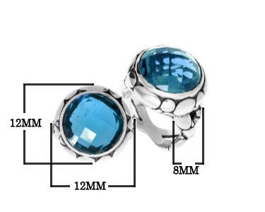 Handmade sterling silver Balinese ring with round-cut Blue Topaz Quartz in a bold bezel.