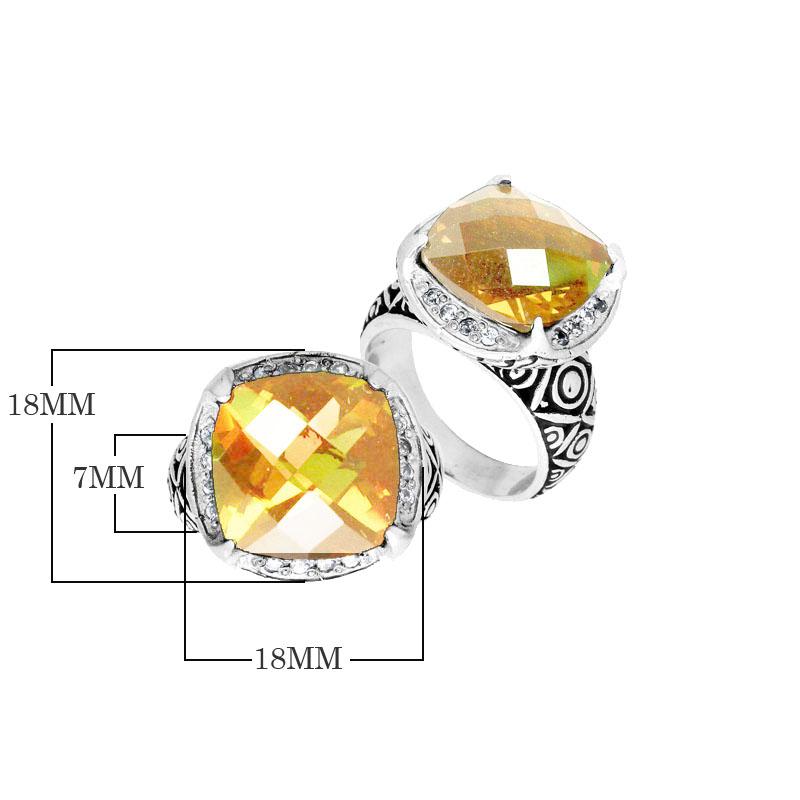 Handmade sterling silver Balinese ring with cushion-cut Lemon Quartz in a detailed setting.