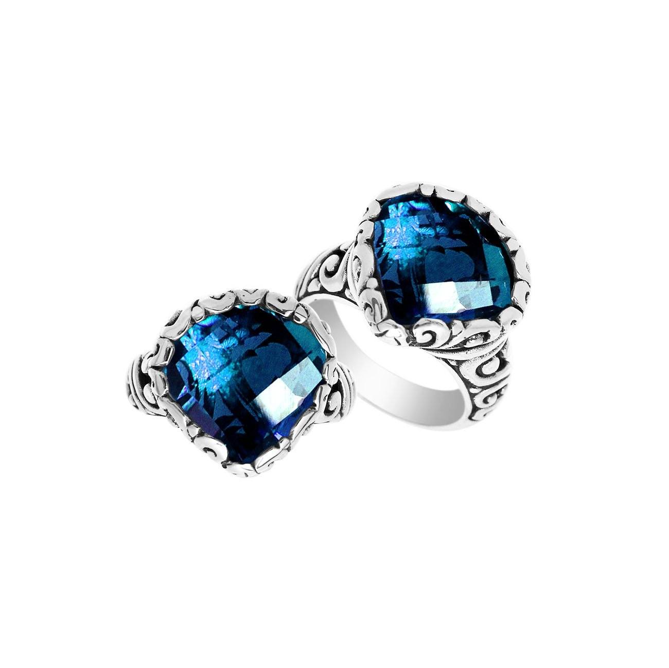 Handmade sterling silver Balinese ring with cushion-cut London Blue Topaz Quartz and scrollwork detailing.