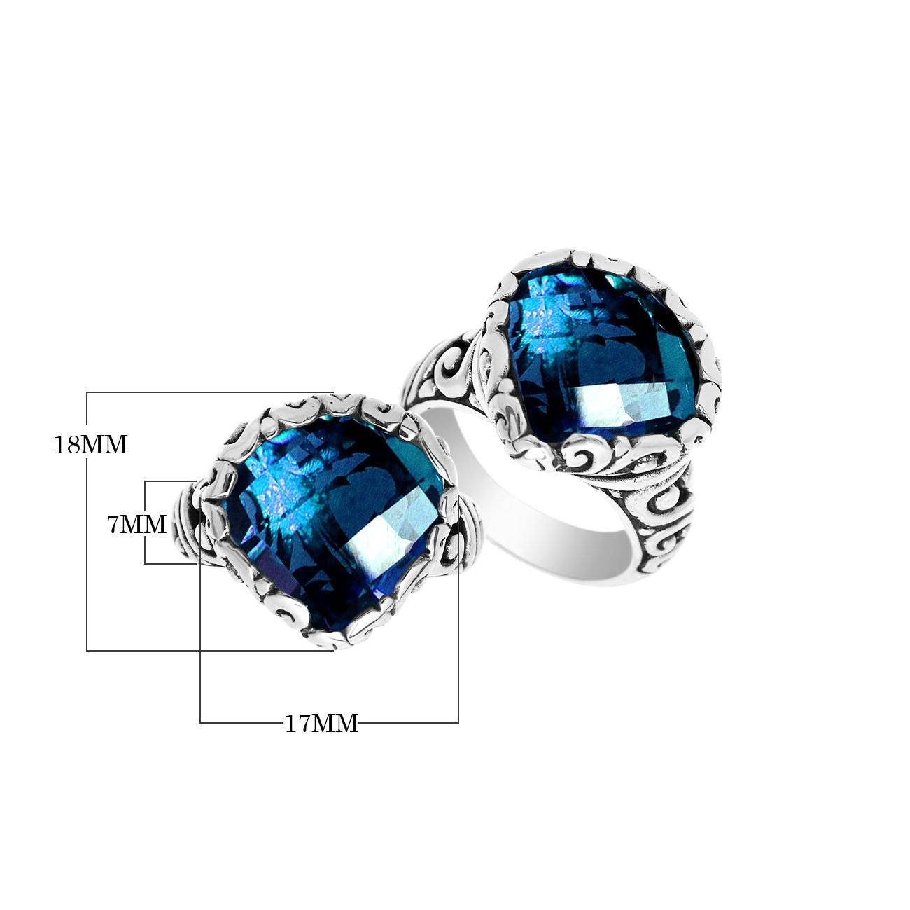 Handmade sterling silver Balinese ring with cushion-cut London Blue Topaz Quartz and scrollwork detailing.