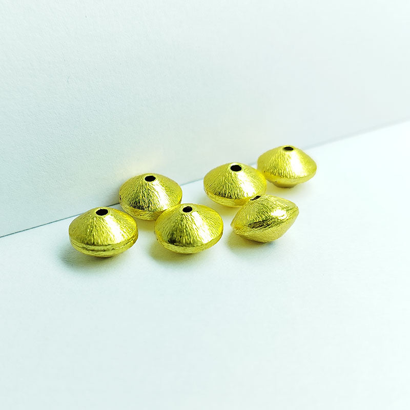 Handcrafted brushed bicone bead made from copper with 18K gold overlay, crafted in India.