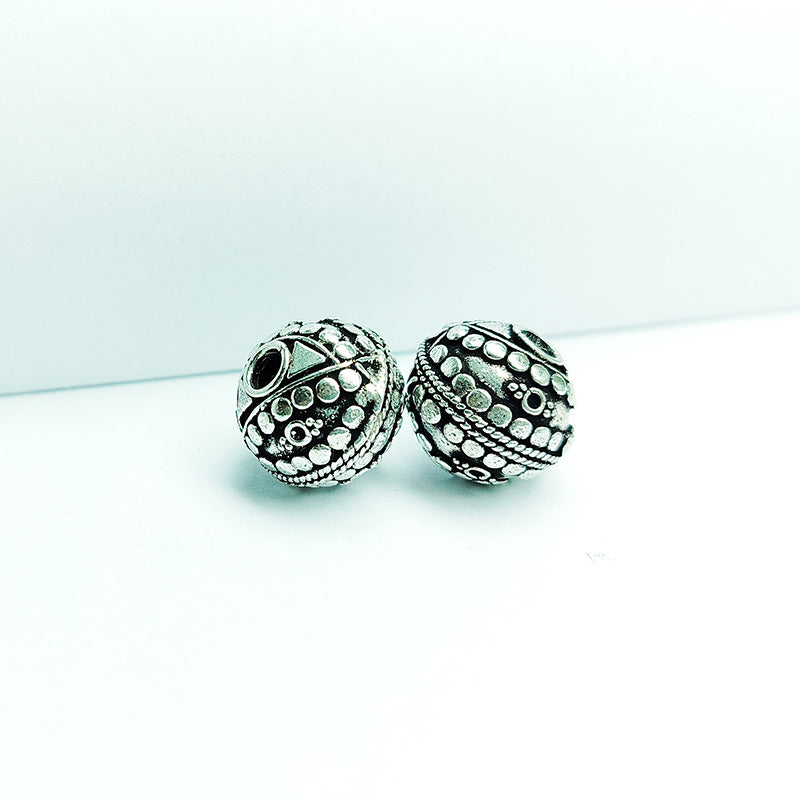 Handcrafted silver overlay round bead from India with oxidized finish and engraved decorative design for retail jewelry making