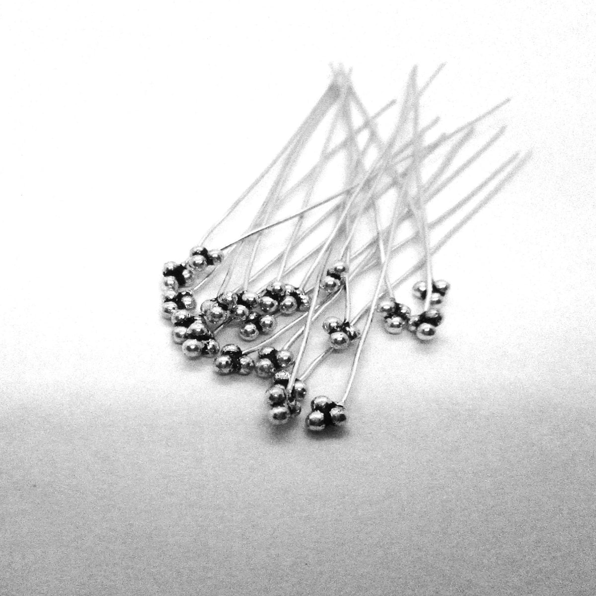 India handcrafted silver overlay over copper triple-ball head pin for retail jewelry crafting.