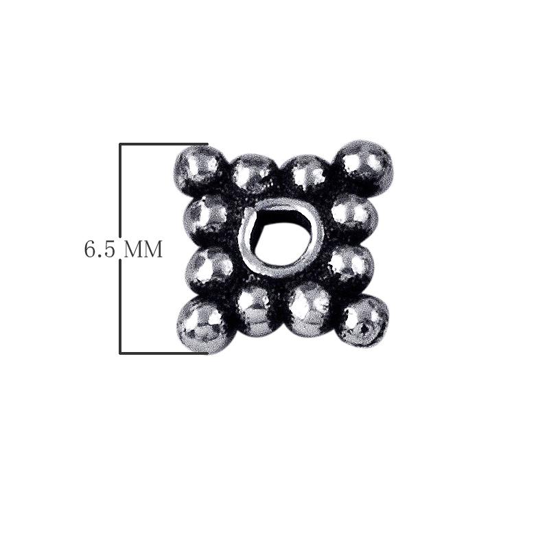Silver overlay over copper bubble spacer beads handcrafted in India with cluster design and polished finish.